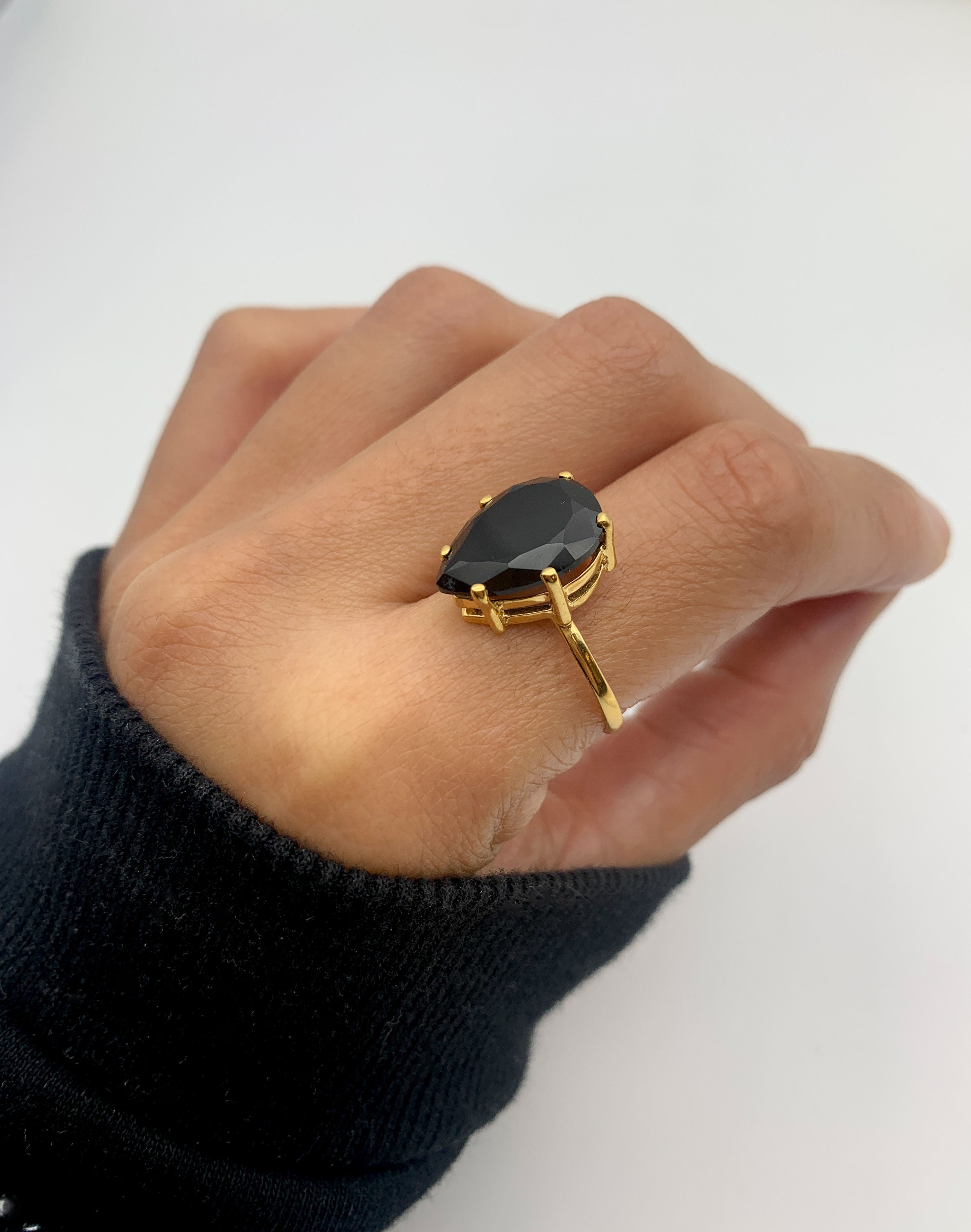 Onyx Ring makes a bold fashion statement with deep mystique.