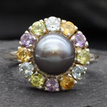 Black Pearl complemented by Amethyst and Citrine gemstones in a sterling silver halo for colorful elegance