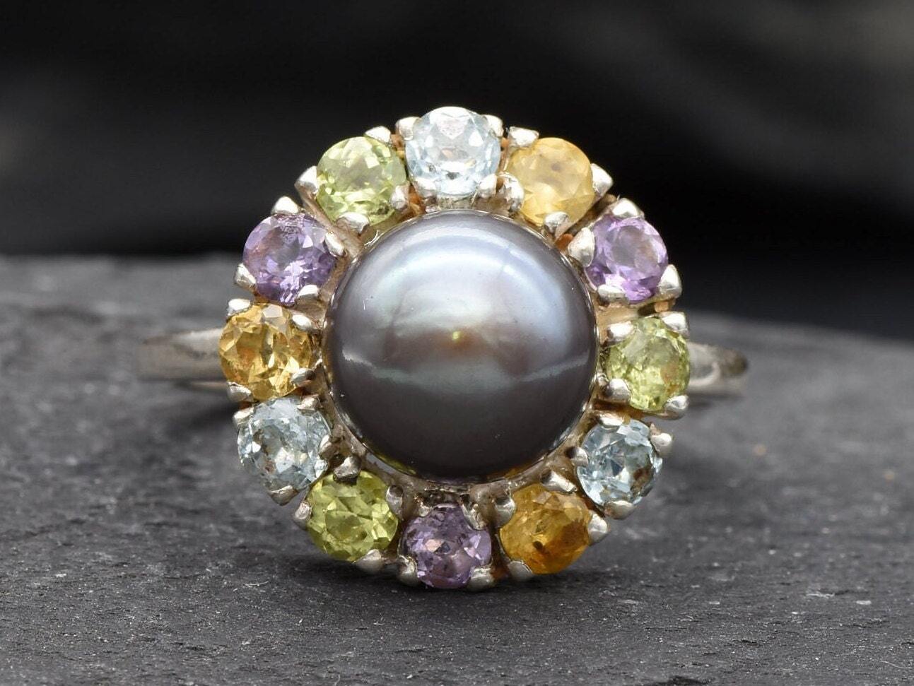 Black Pearl complemented by Amethyst and Citrine gemstones in a sterling silver halo for colorful elegance
