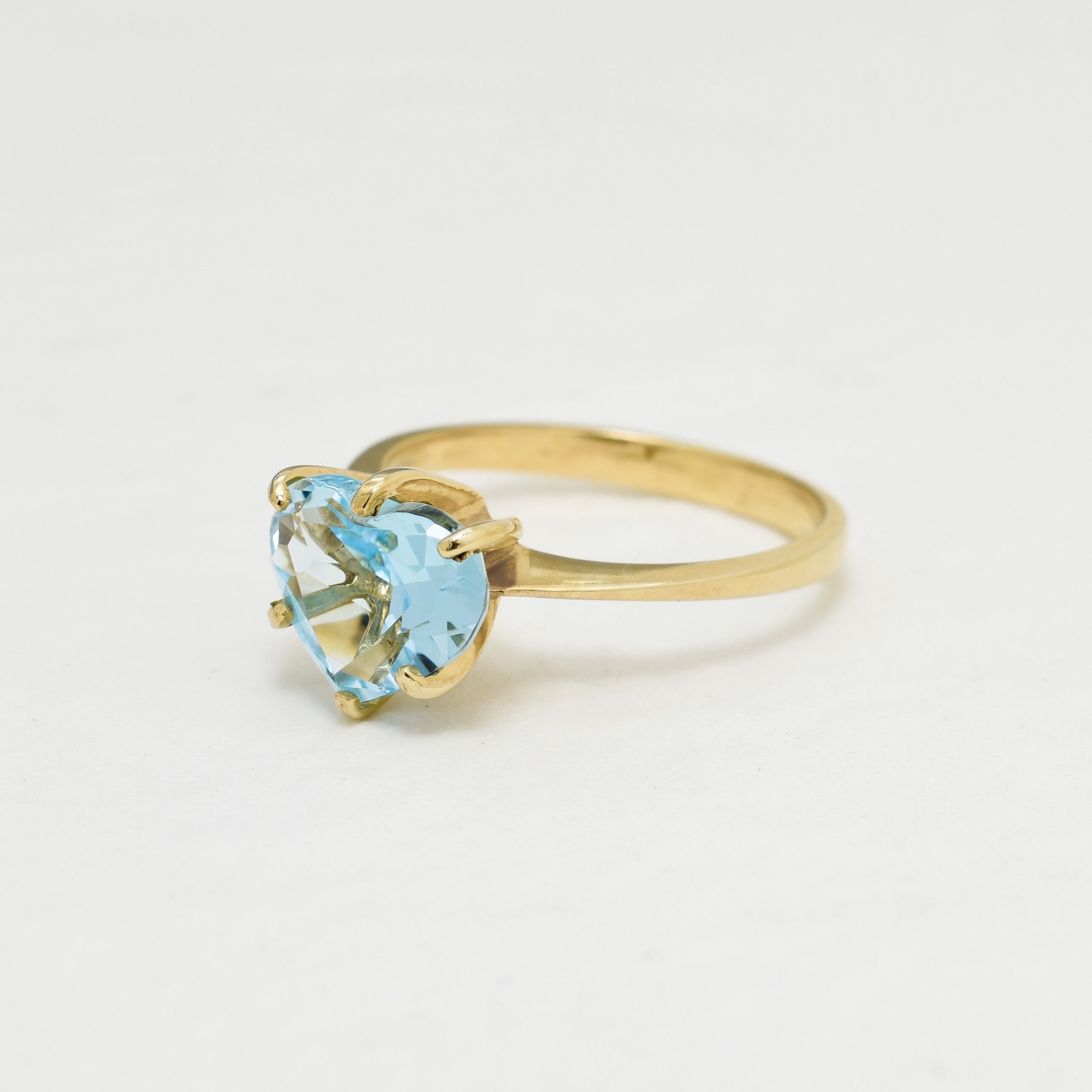 Heart Aquamarine March birthstone ring crafted in 18k Yellow Gold over Solid 925 Sterling Silver. Blue gemstone ring perfect as a valentine's gift idea, can be worn as an everyday ring that brings tranquility, aids in self-expression, and protects travelers. For courage, communication, soothing
