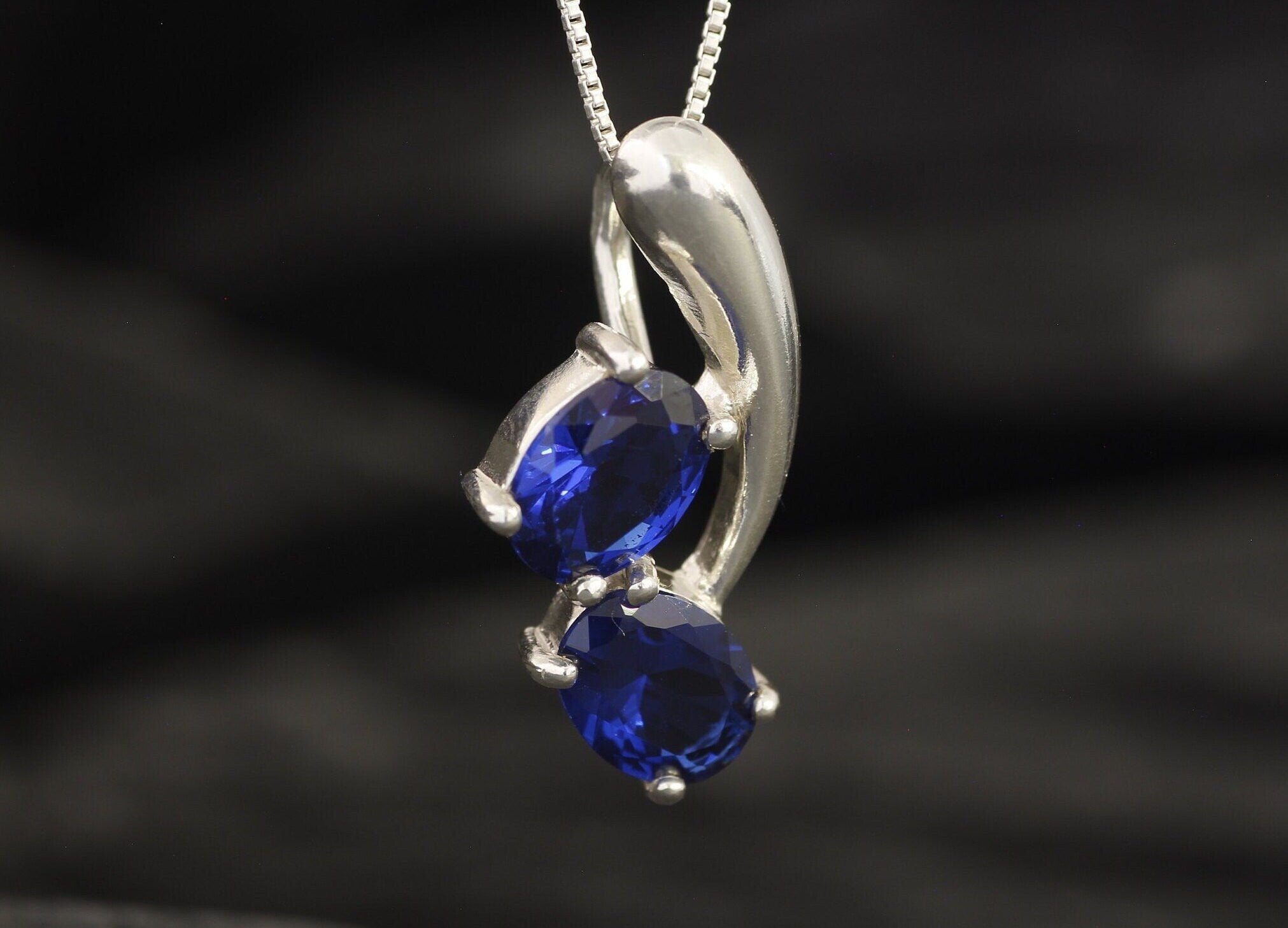 Elegant Two-Stone Sapphire Pendant in Sterling Silver, perfect September birthday gift symbolizing sincerity and faithfulness.