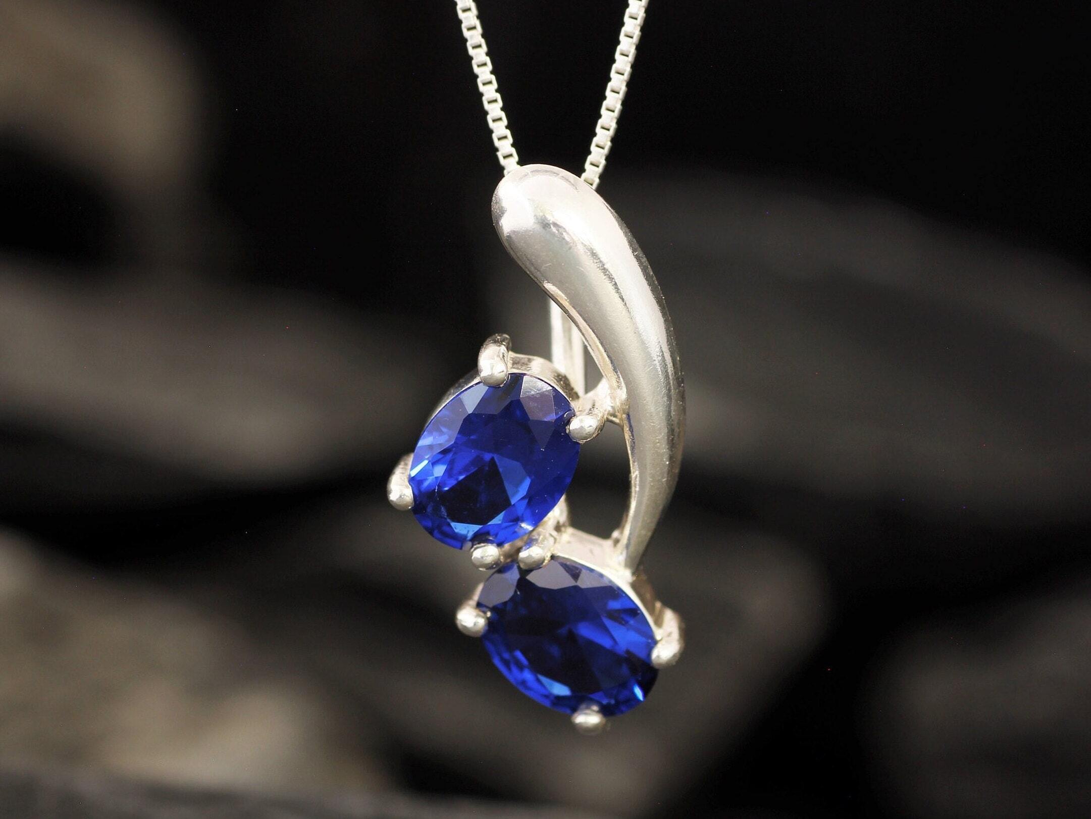 Created Sapphire Pendant made in 925 Sterling Silver with Oval Created Blue Sapphire in Two-Stone setting, September Birthstone gift idea, symbolizes sincerity, truth, and faithfulness, ideal for everyday wear and perfect for birthday gifting and special occasions.