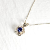 Blue Tanzanite Flower Pendant set in Solid 925 Sterling Silver, in a round cut, stunning blue color, and prong setting. December birthstone necklace that promotes spiritual awakening, ideal for everyday wear, perfect gift idea for her