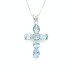 Blue Topaz pendant in silver cross style for modern jewelry lovers