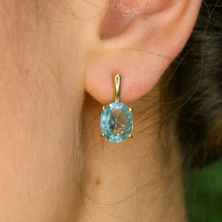 Blue topaz earrings in 925 sterling silver featuring lever back clasp and emerald cut stones