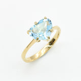 Blue topaz heart gold ring featuring 10x8mm diamond-cut natural gemstone in polished gold setting