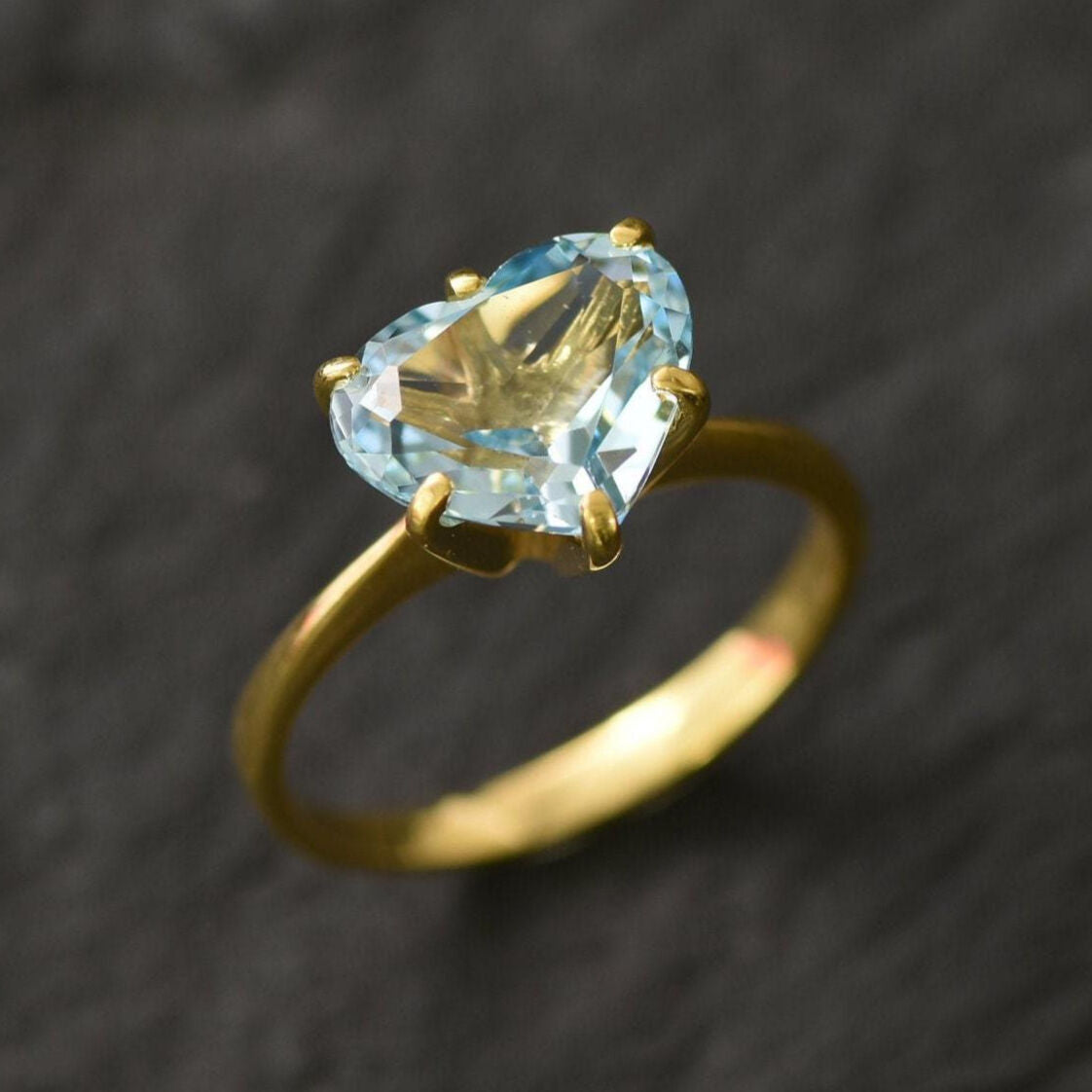 Blue topaz heart ring set in gold vermeil showcasing diamond-cut gemstone