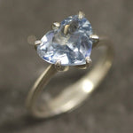 Blue topaz heart ring set in sterling silver showcasing diamond-cut gemstone and polished silver band