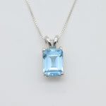 Blue topaz pendant set in 925 sterling silver with emerald cut gemstone and classic prong setting