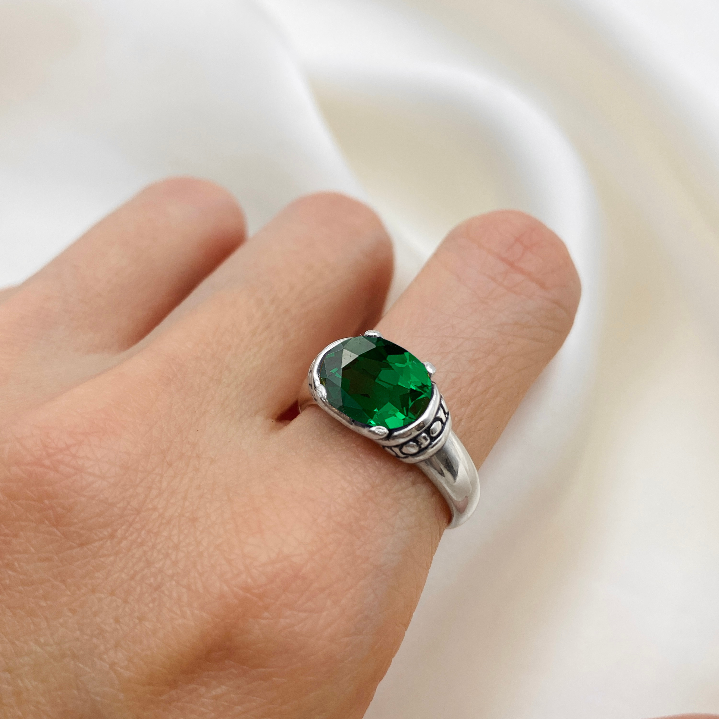 Elegant 925 Sterling Silver ring featuring an oval Created Green Emerald, perfect for May birthdays and special occasions.