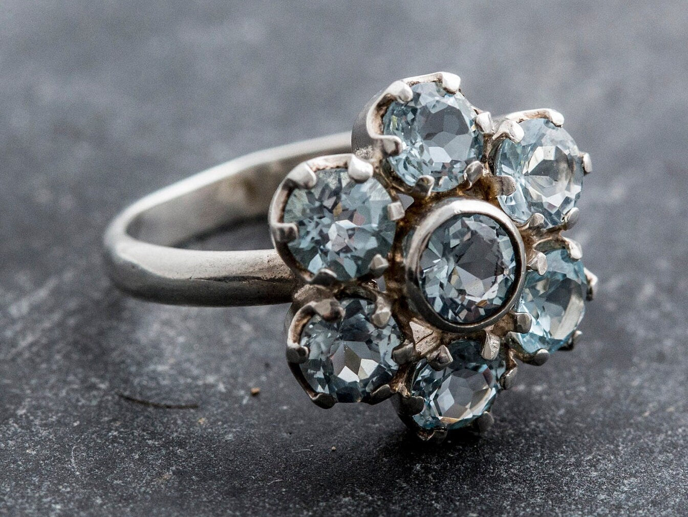 Brazilian Blue Topaz ring in flower cluster design, enhances mental clarity, unique gift idea for December born, perfect for holiday portraits