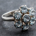 Brazilian Blue Topaz ring in flower cluster design, enhances mental clarity, unique gift idea for December born, perfect for holiday portraits