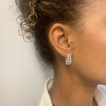 Close-up of woman wearing solid 925 sterling silver beaded hoop earrings