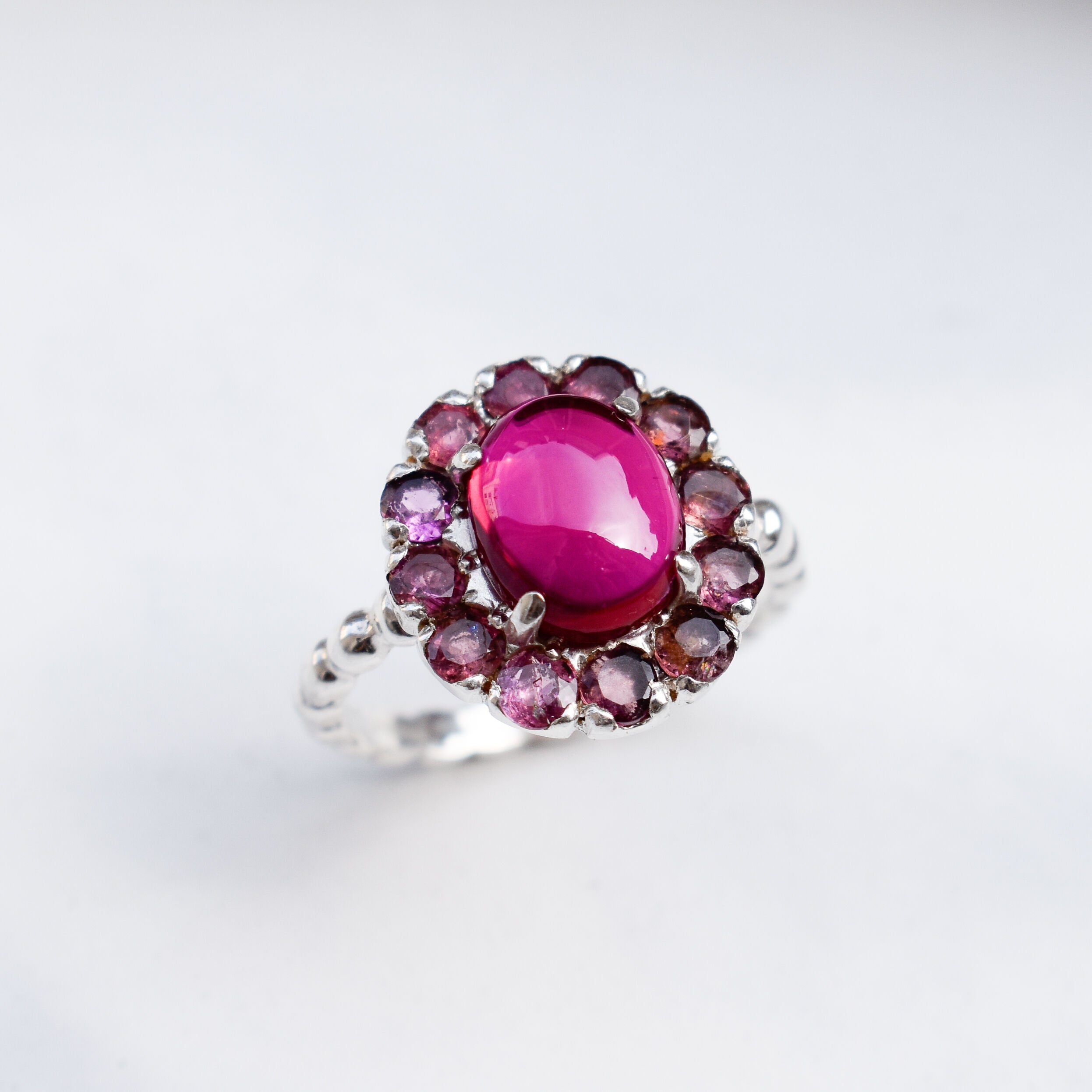 Created Ruby Ring made in 925 Sterling Silver with Oval Created Red Ruby in Halo setting, July Birthstone gift idea, symbolizes nobility, purity, and passion, ideal for everyday wear and perfect for birthday gifting and special occasions.