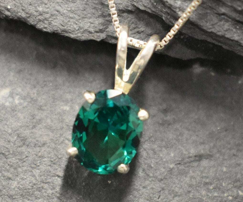 Charming 925 Sterling Silver Pendant with a vibrant Oval Created Green Emerald, a thoughtful gift for any occasion.