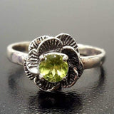 Dainty oxidized floral ring with Natural Peridot, boosts confidence, ideal for casual days or spiritual occasions.