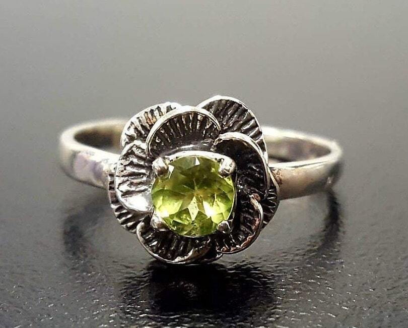 Dainty oxidized floral ring with Natural Peridot, boosts confidence, ideal for casual days or spiritual occasions.