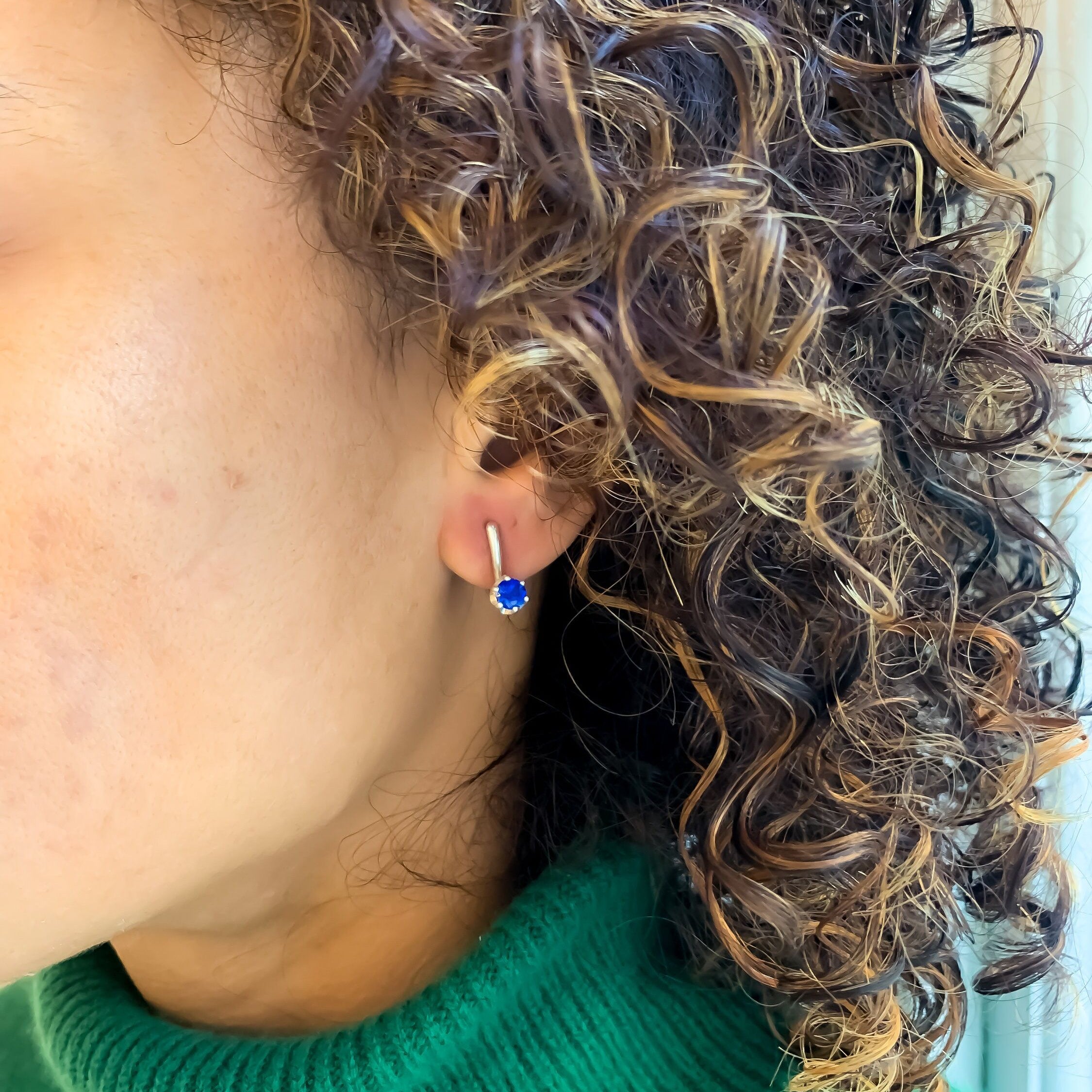 Stylish 925 Sterling Silver Sapphire Earrings featuring a stunning Round Created Blue Sapphire, perfect for special occasions.