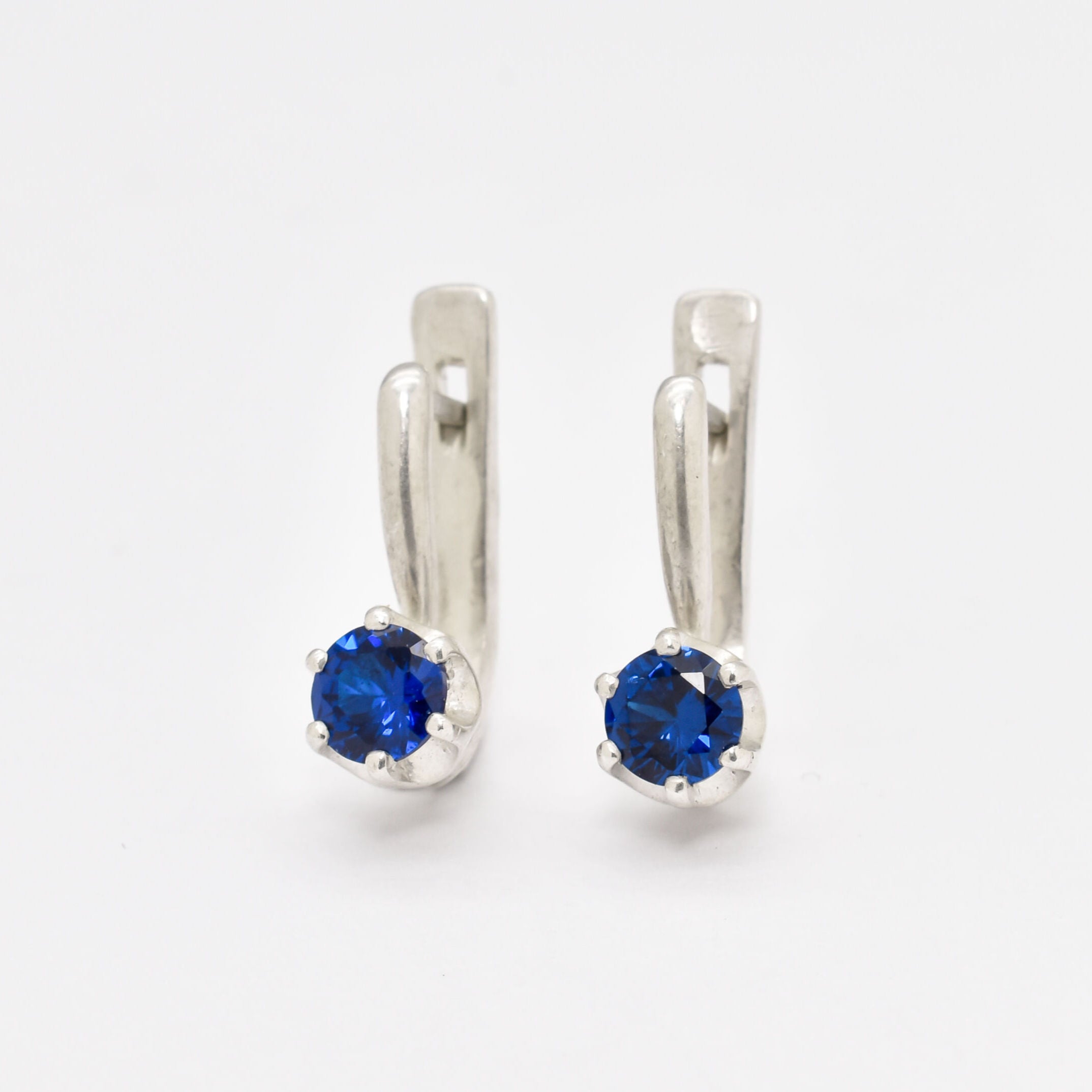 Created Sapphire Earrings made in 925 Sterling Silver with Round Created Blue Sapphire in Solitaire setting, September Birthstone gift idea, symbolizes sincerity, truth, and faithfulness, ideal for everyday wear and perfect for birthday gifting and special occasions.