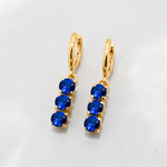 Created Sapphire Earrings made in 18k Gold Vermeil with Round Created Blue Sapphire in Three-Stone setting, September Birthstone gift idea, symbolizes sincerity, truth, and faithfulness, ideal for everyday wear and perfect for birthday gifting and special occasions.