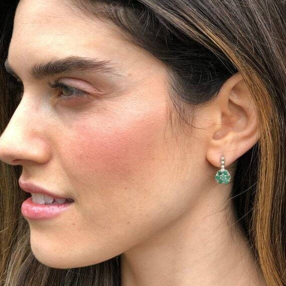 Natural Emerald Flower earrings paired with sleek black blouse for elegant office wear.