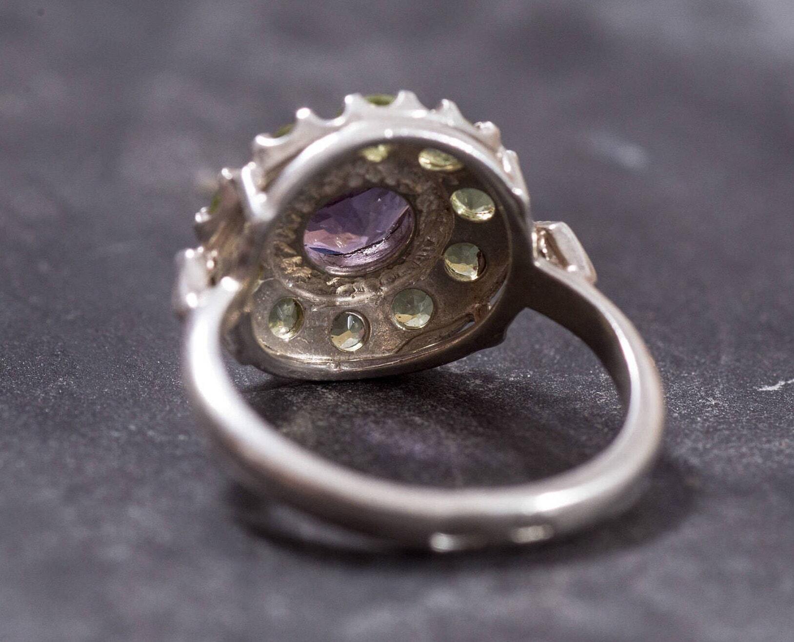 Floral-inspired design with Amethyst and Peridot gems, bringing joy and renewal to any day