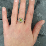 Floral Peridot ring styled on middle finger with Amethyst and Blue Topaz accents, perfect for everyday wear.