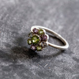 Genuine Peridot cluster ring with vibrant Amethyst and Blue Topaz accents set in sterling silver, ideal for birthdays and anniversaries.