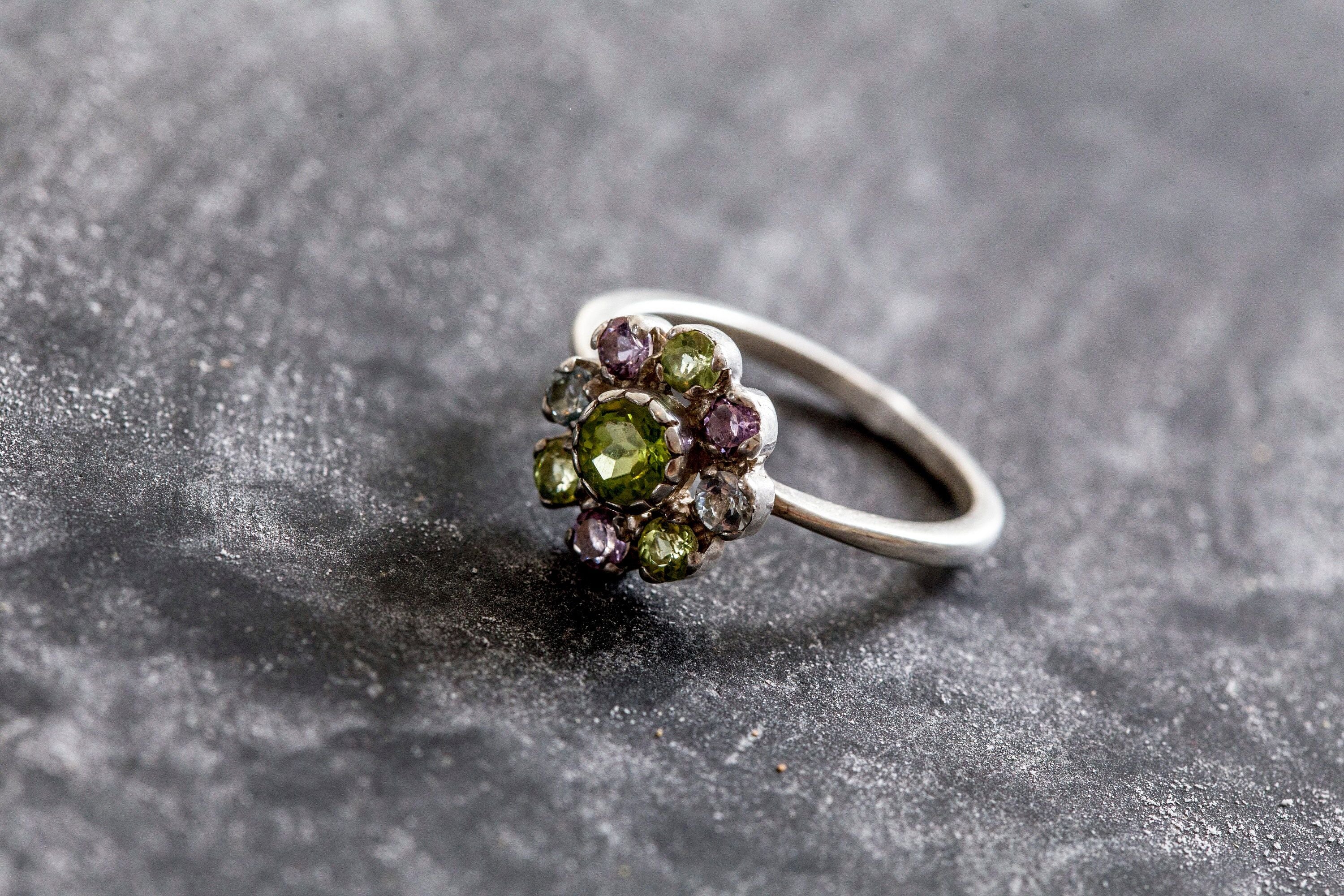 Genuine Peridot cluster ring with vibrant Amethyst and Blue Topaz accents set in sterling silver, ideal for birthdays and anniversaries.