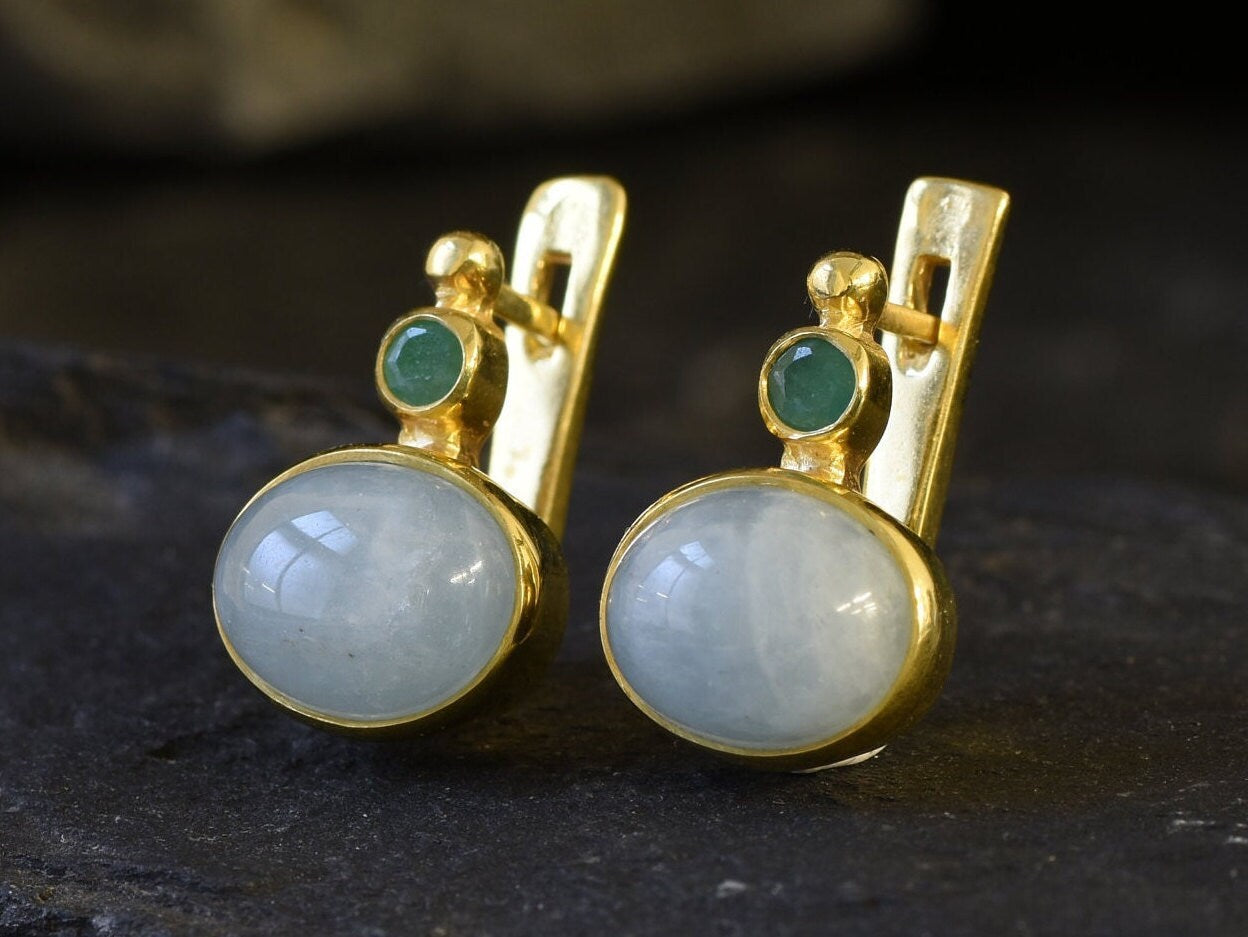 A scenic sunset over a calm lake, with vibrant orange and purple hues reflecting on the water's surface.