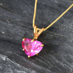 Pink Alexandrite gemstone on gold chain, enhances feminine grace and charm