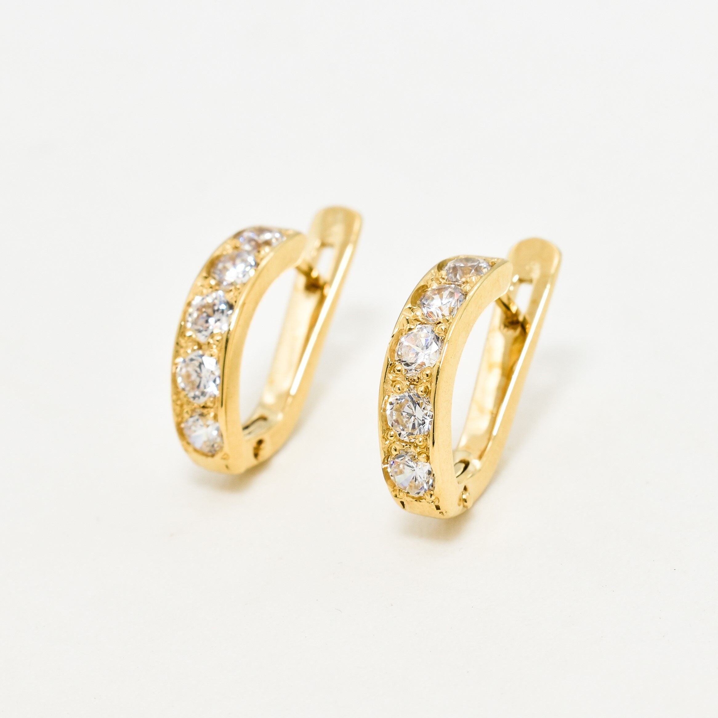 Yellow gold plated earrings with Diamond April birthstone in round cut and prong setting. Dainty hoops ideal gift for her or anniversary present. Diamond - Symbol of eternal love, purity, and inner strength. For clarity, and abundance