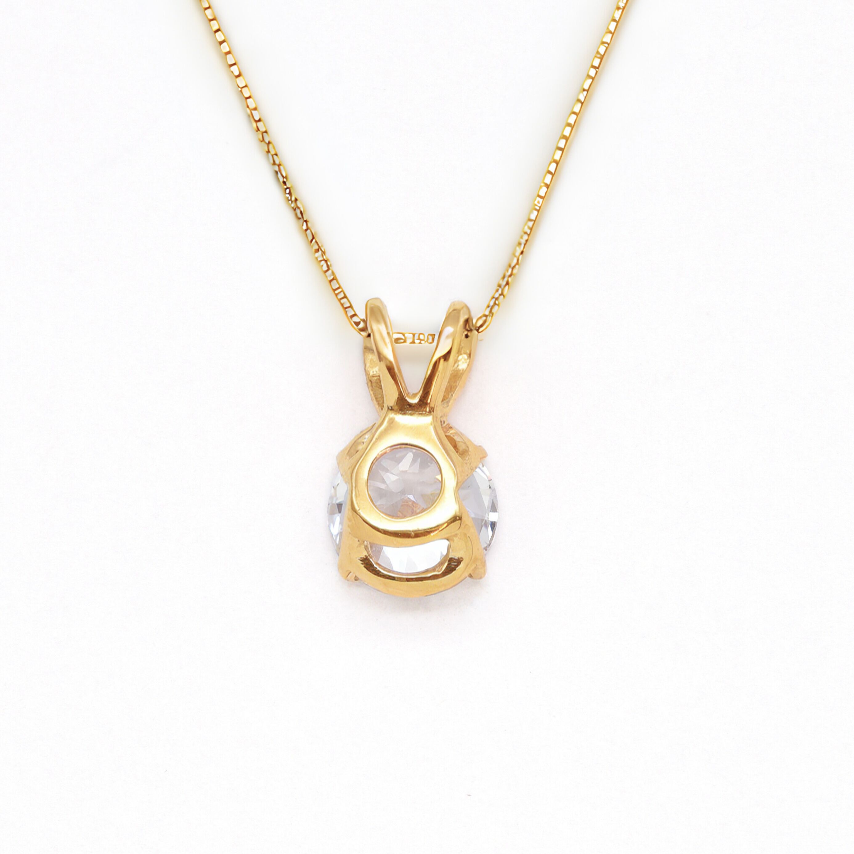 18k Yellow gold plated pendant with Diamond April birthstone in diamond and prong setting. Solitaire necklace ideal for special occasions and everyday wear. Round diamond necklace symbolizing eternal love, purity, and inner strength.