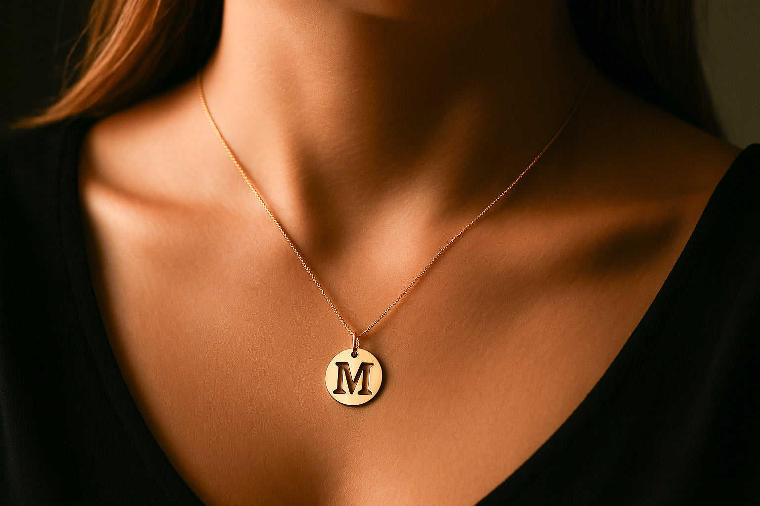 Gold Disc Letter Pendant worn by a Model
