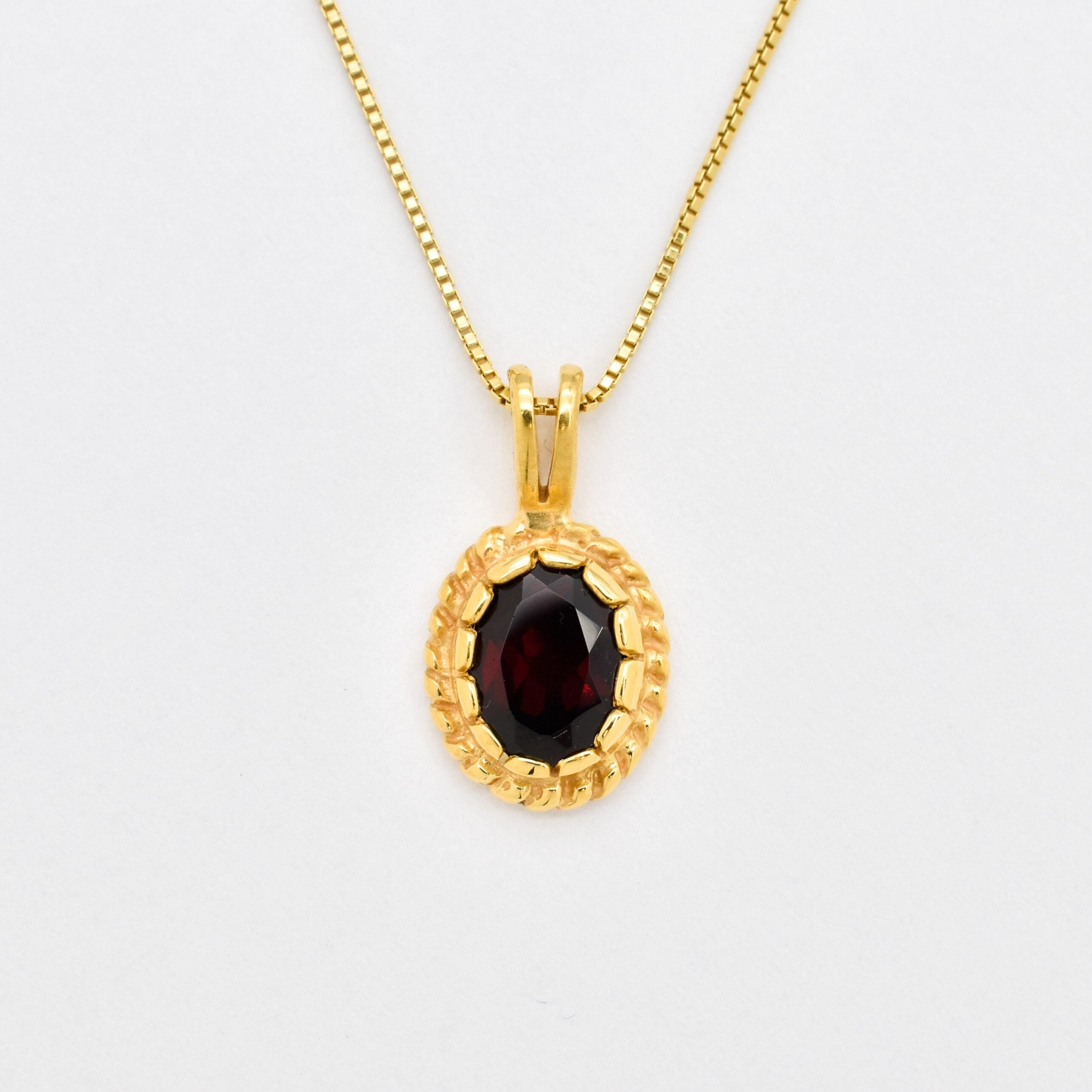 Natural Garnet January birthstone necklace crafted 18k yellow gold vermeil over solid 925 sterling silver, in oval cut and prong setting. Red solitaire gemstone pendant perfect for special occasions, and for layering necklaces. Red Oval Pendant that promotes energy, passion, and safety in travel. Often associated with love and commitment.