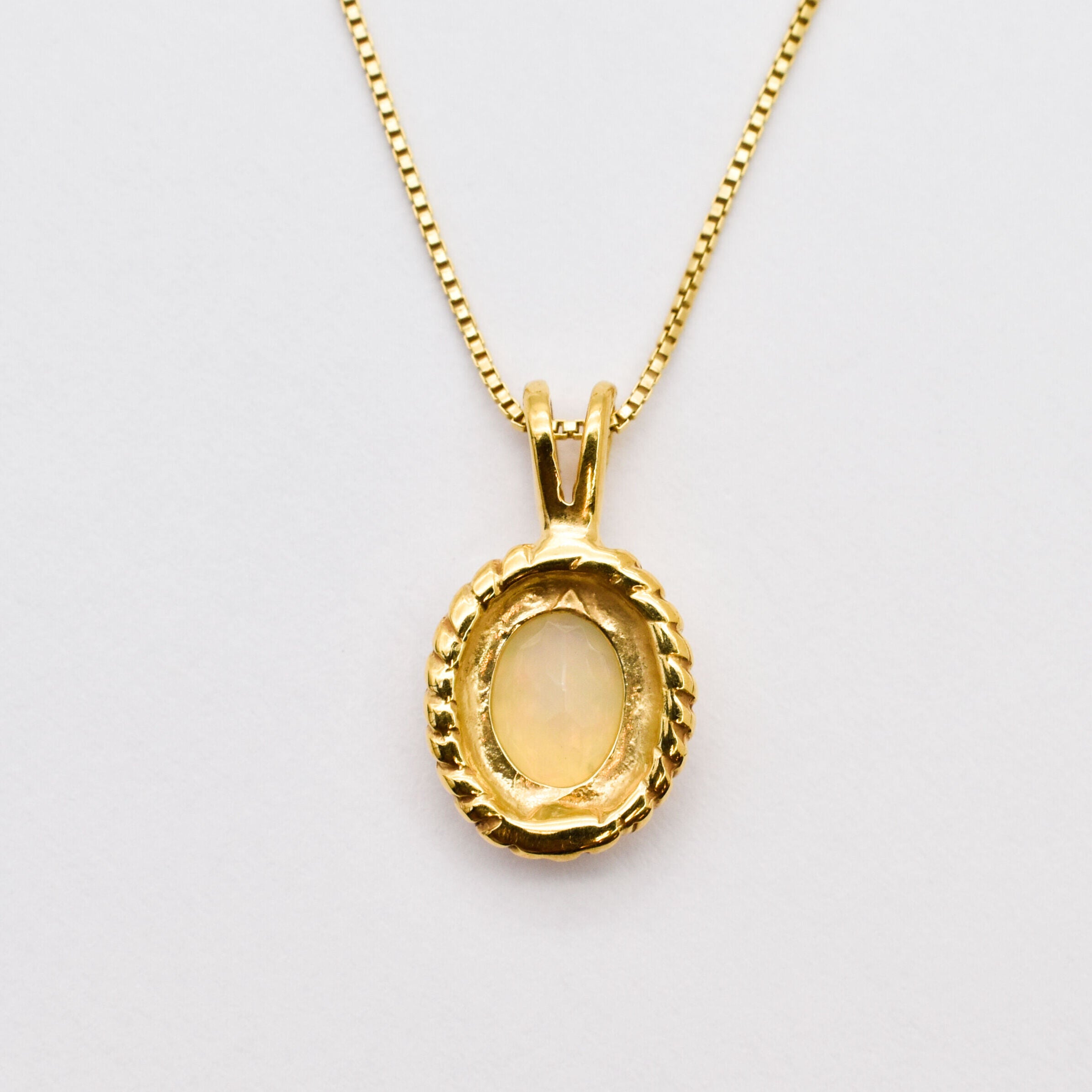 Solitaire Natural Opal Necklace crafted in 18k yellow gold vermeil over solid 925 sterling silver, in oval cut, and prong setting. Vintage Opal Pendant ideal for special occasions, for layering necklaces or wearing solo. October birthstone stimulates imagination and love.