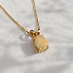 Natural Opal Pendant set in 18k yellow gold over solid 925 sterling silver. October birthstone necklace that is believed to stimulate imagination and love. An oval solitaire necklace gift idea for her, ideal for solo wearing or layering, can be worn on special occasions and casual wears.