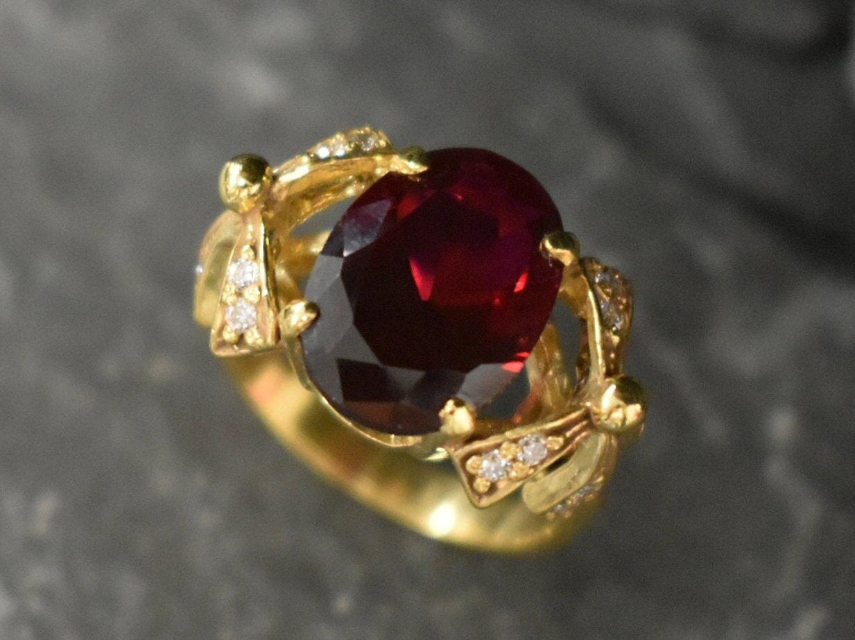 Elegant 18k Gold Vermeil Ruby Ring with a brilliant Oval Created Red Ruby, embodies passion and ideal for everyday elegance.