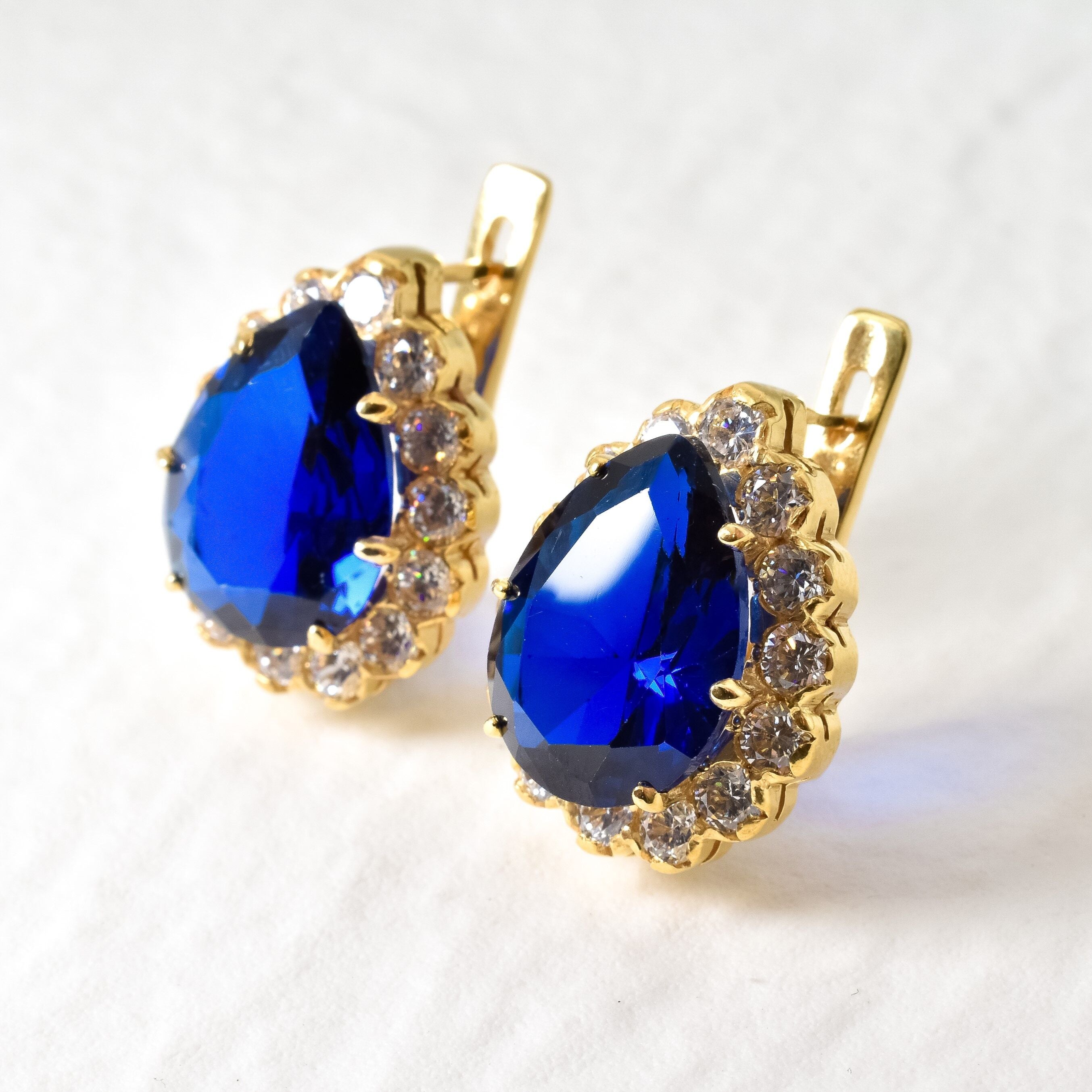 Created Sapphire Earrings made in 18k Gold Vermeil with Pear Created Blue Sapphire in Prong setting, September Birthstone gift idea, symbolizes sincerity, truth, and faithfulness, ideal for everyday wear and perfect for birthday gifting and special occasions.