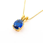 Elegant 18k Gold Vermeil pendant with a vibrant oval blue sapphire, symbolizing loyalty and ideal for daily wear.