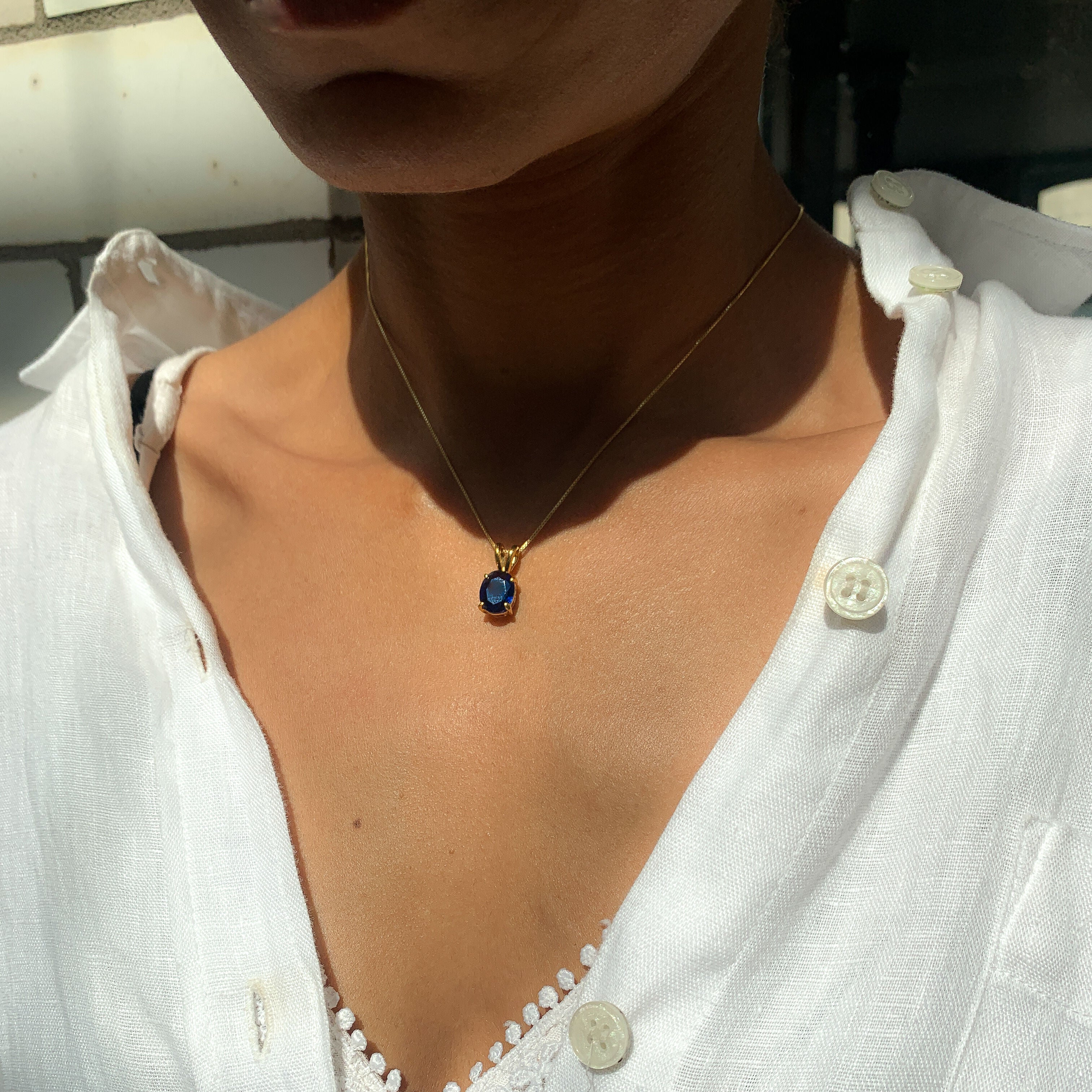 18k Gold Vermeil Sapphire Pendant featuring a stunning oval blue sapphire, perfect for September birthdays and special occasions.