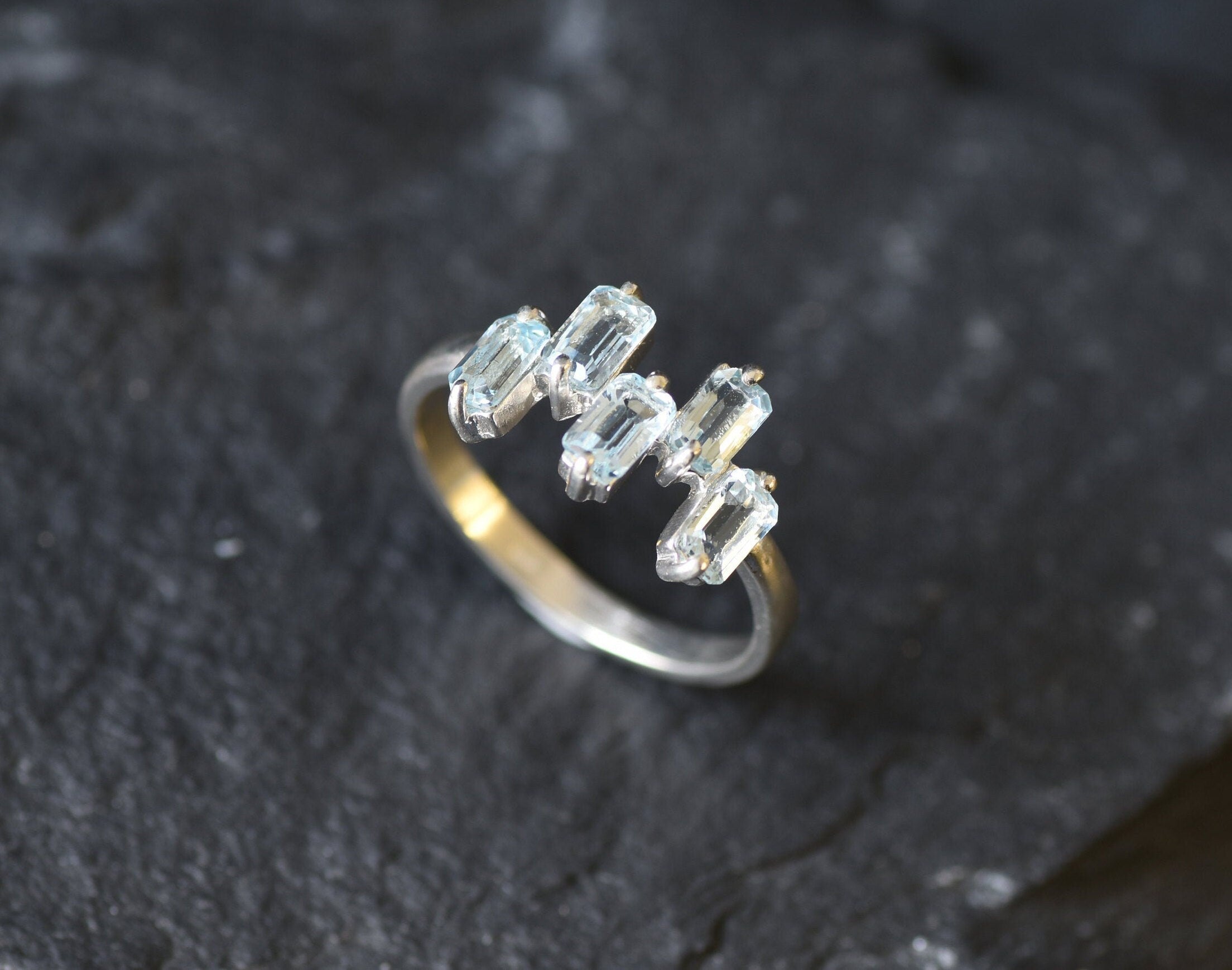 Handcrafted silver band with topaz stones for chic events or gemstone lovers.