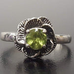 Handmade Sterling Silver ring with floral Peridot detail, perfect for eco-conscious gifting and nature lovers.