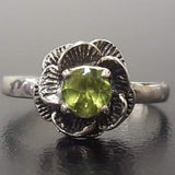 Handmade Sterling Silver ring with floral Peridot detail, perfect for eco-conscious gifting and nature lovers.