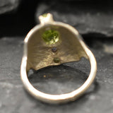 Detailed silver craftsmanship highlights the Peridot & Amethyst stones, perfect for collectors and jewelry enthusiasts.