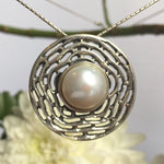 Japanese Natural Pearl necklace with delicate circular silverwork, enhances grace and poise, ideal for June birthdays or milestone anniversaries.