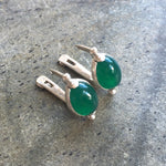 Chic 925 Sterling Silver earrings with an oval Created Green Emerald, perfect for May birthdays and everyday elegance.