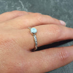 Stylish Caribbean Larimar ring offering a serene look, ideal for beach weddings or stress-relief gifts.