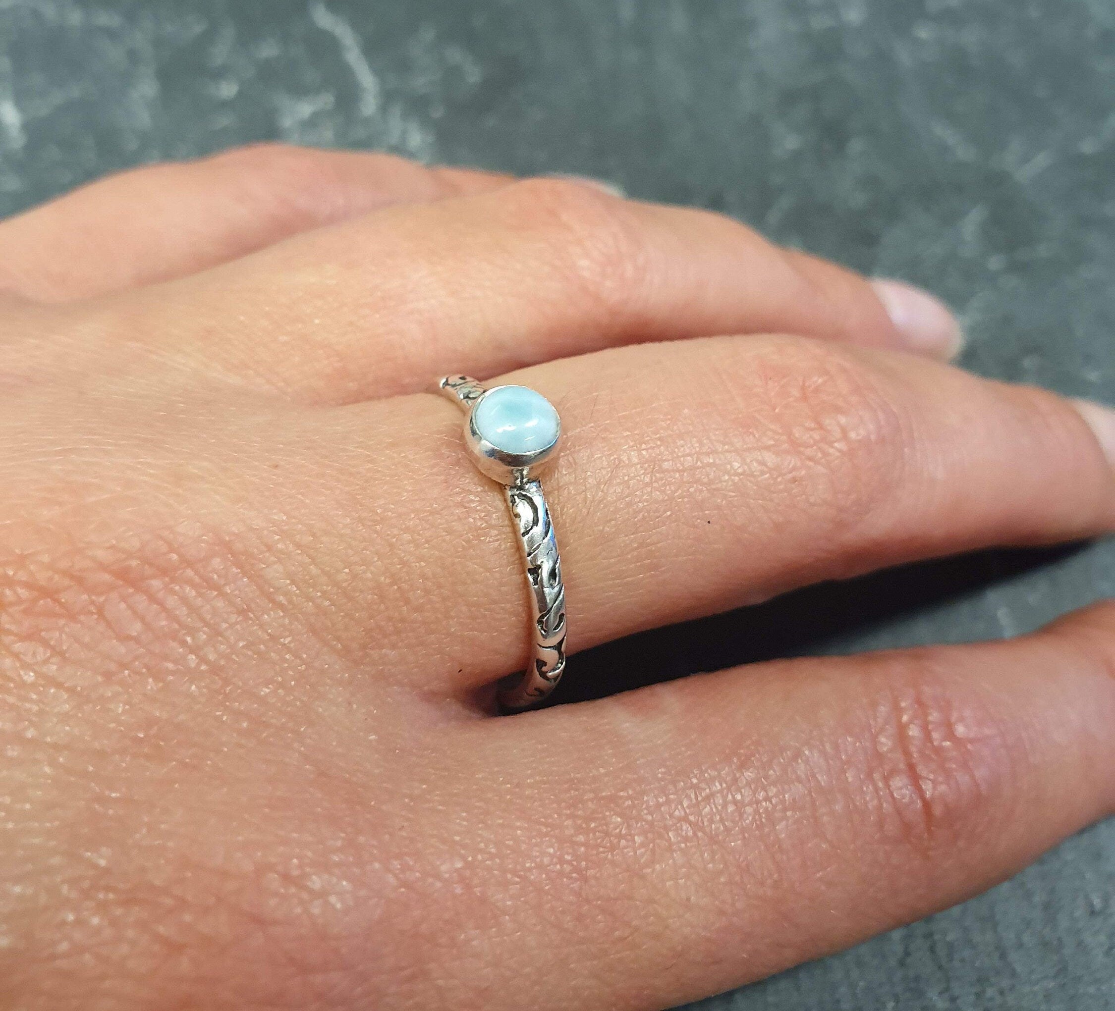 Stylish Caribbean Larimar ring offering a serene look, ideal for beach weddings or stress-relief gifts.