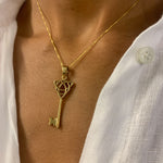 Long Key Pendant set in 18k Yellow Gold Vermeil over Solid 925 Sterling Silver. Gold Key Necklace with Trinity Know, perfect as a statement necklace, can be styled with minimalist outfit.  Trinity knot represents unity, eternal love, and the cycle of existence.